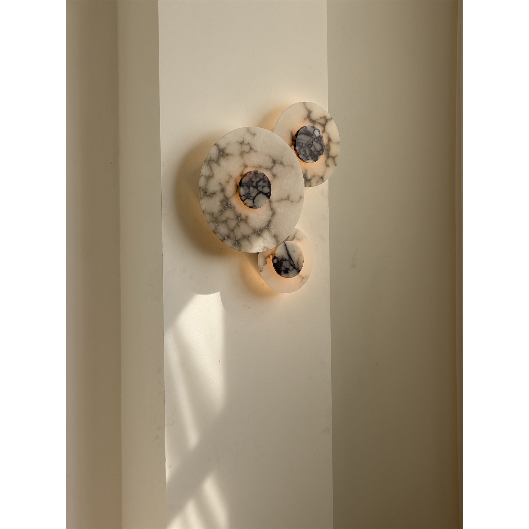 A detailed look at the three heads of the Median Combination Wall Lamp.