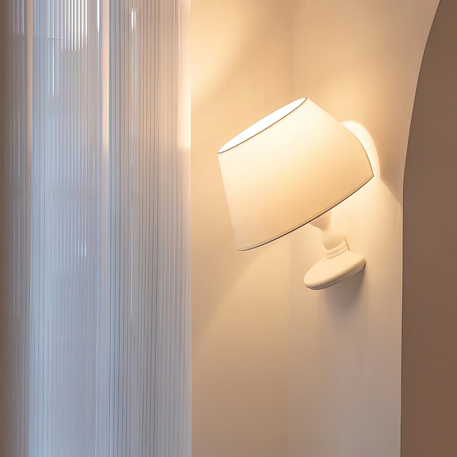 Melampo Wall Lamp installed in a modern bedroom setting.