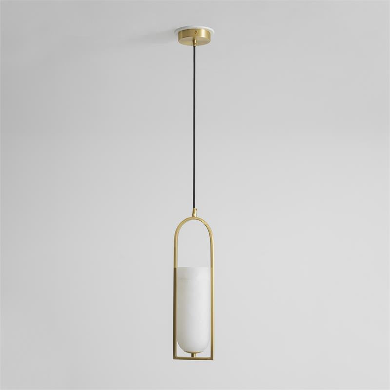 Melange pendant lamp in a minimalist bedroom setting.