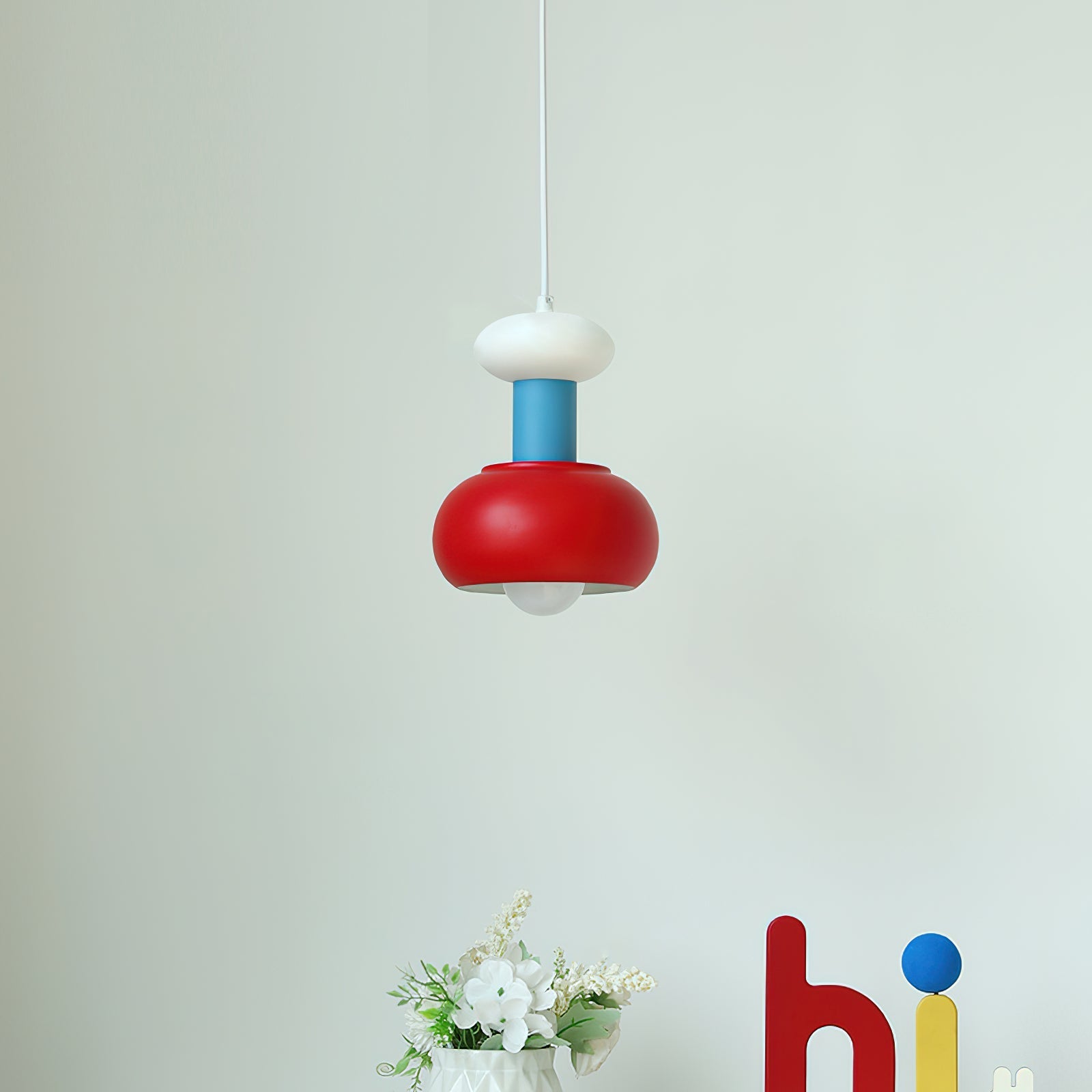 Meli Pendant Light shown in a creative workspace.