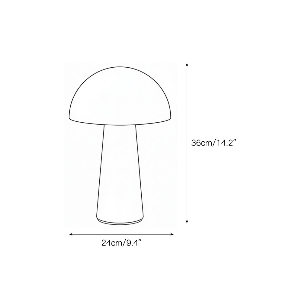 The Menta Table Lamp illuminated, casting a warm glow.