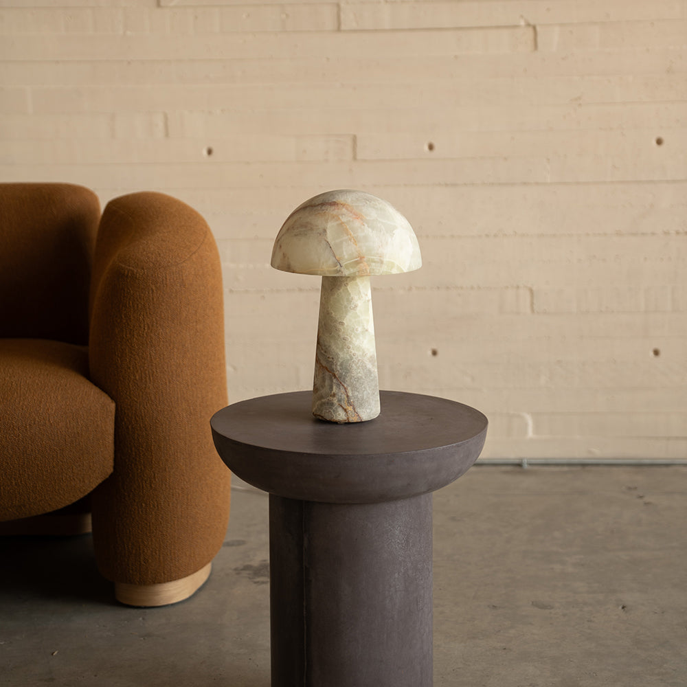 Menta Table Lamp styled on a side table in a living room.