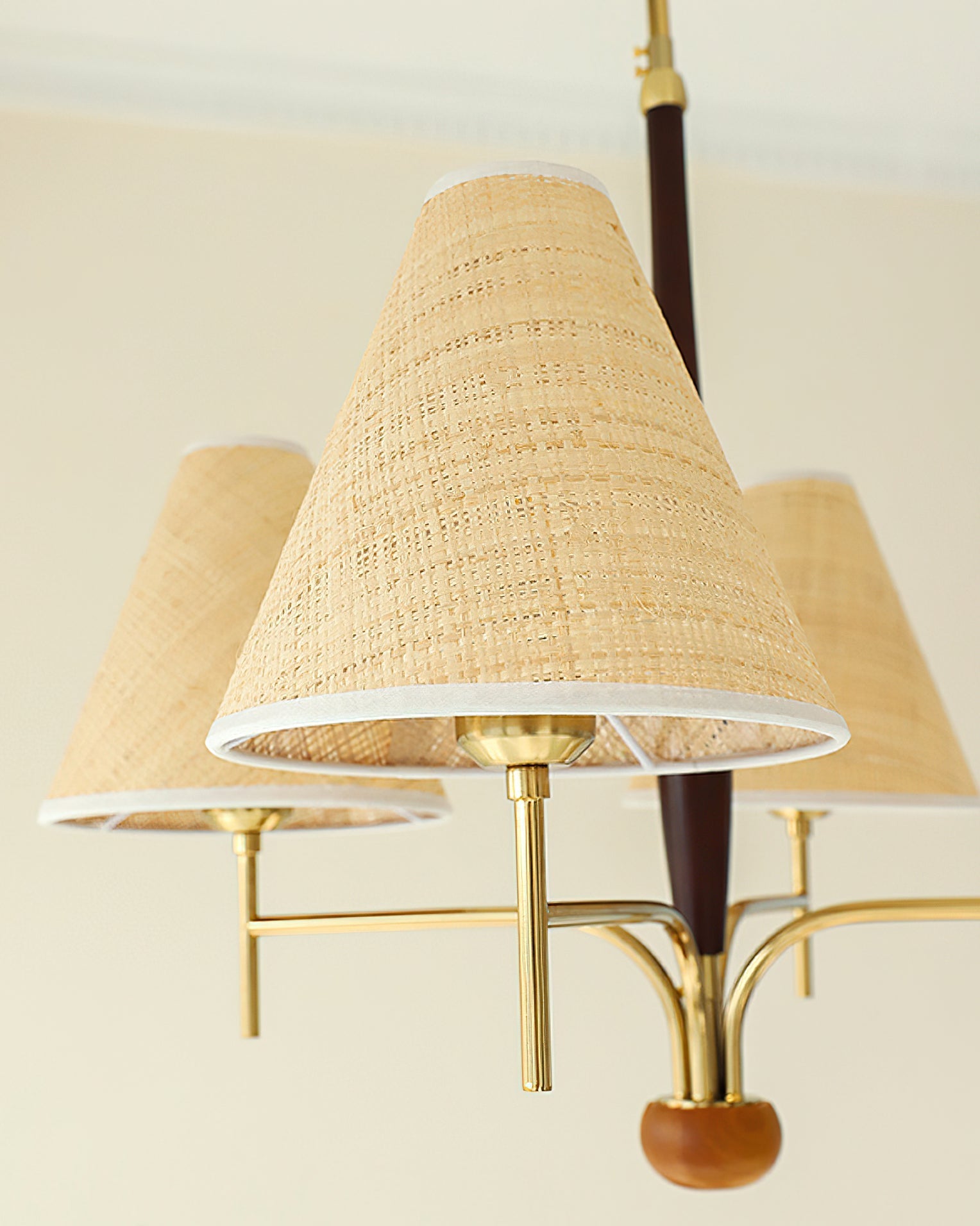 The texture of the beige fabric shade when the light is off.