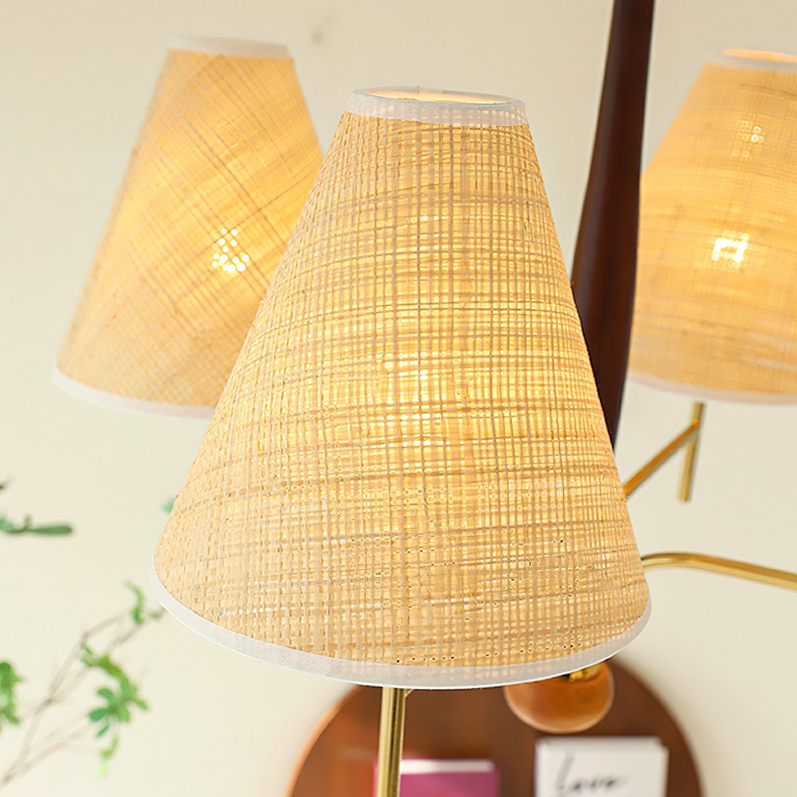 The texture of the beige fabric shade when the light is on.