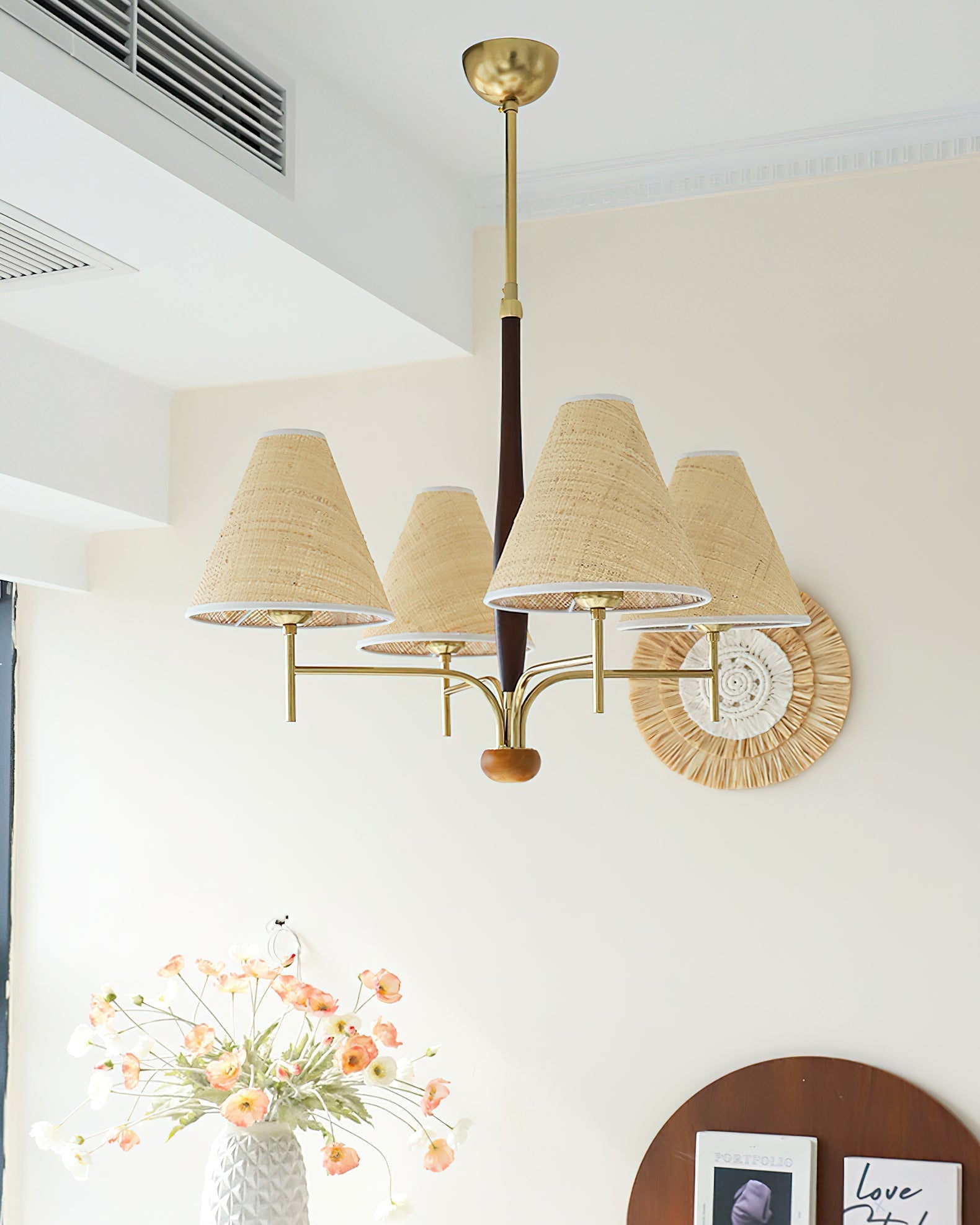Detail shot of the walnut wood accent on the chandelier's frame.
