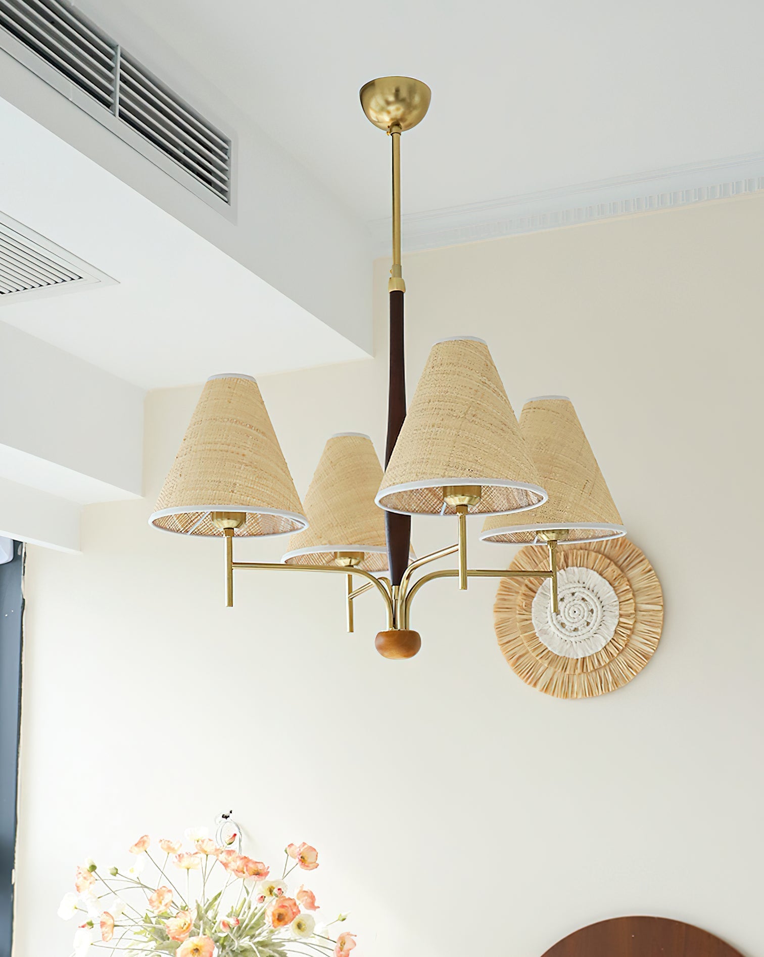 The Mercer Chandelier illuminated, casting a warm and inviting glow.