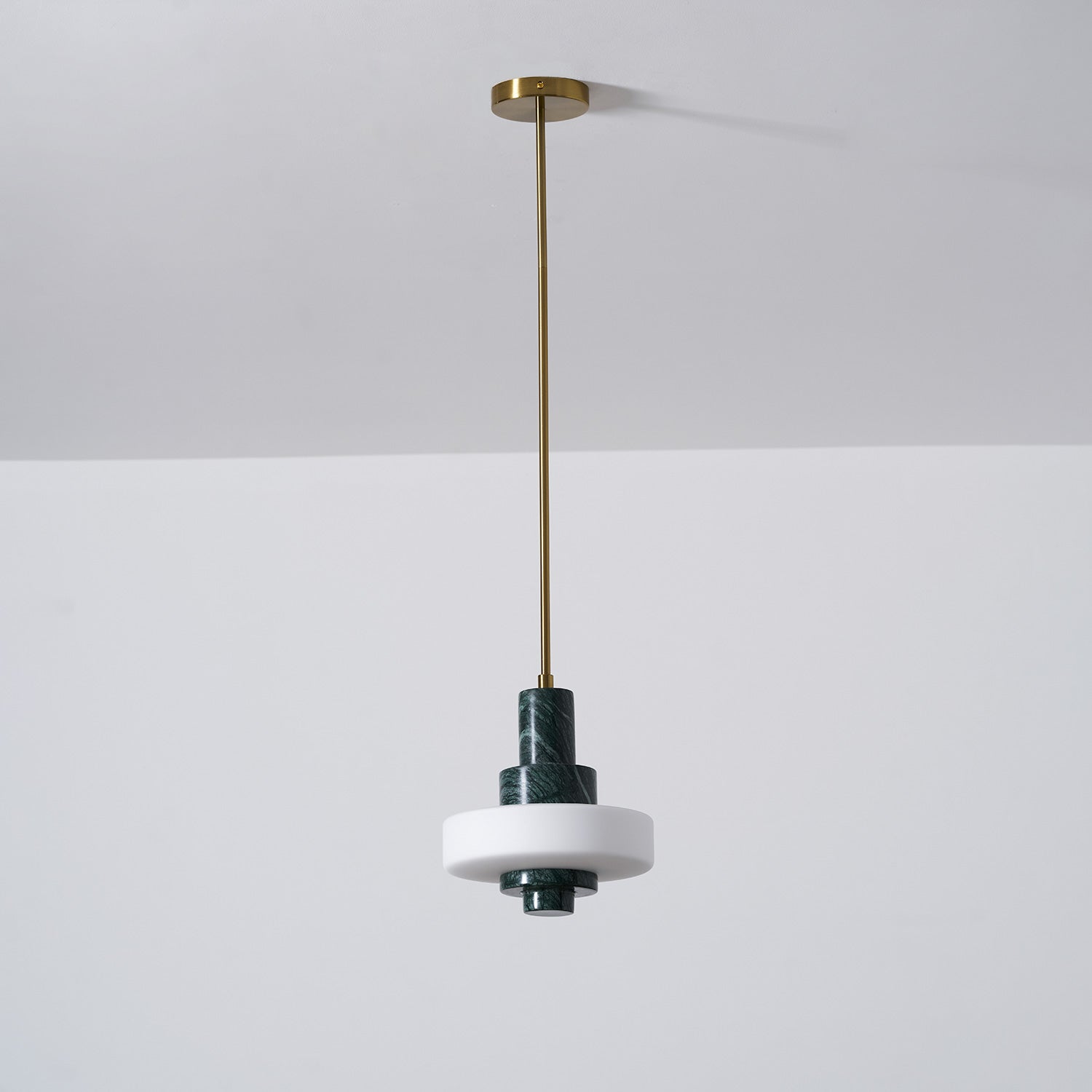 The elegant silhouette of the Mercury Green Marble Pendant Lamp.