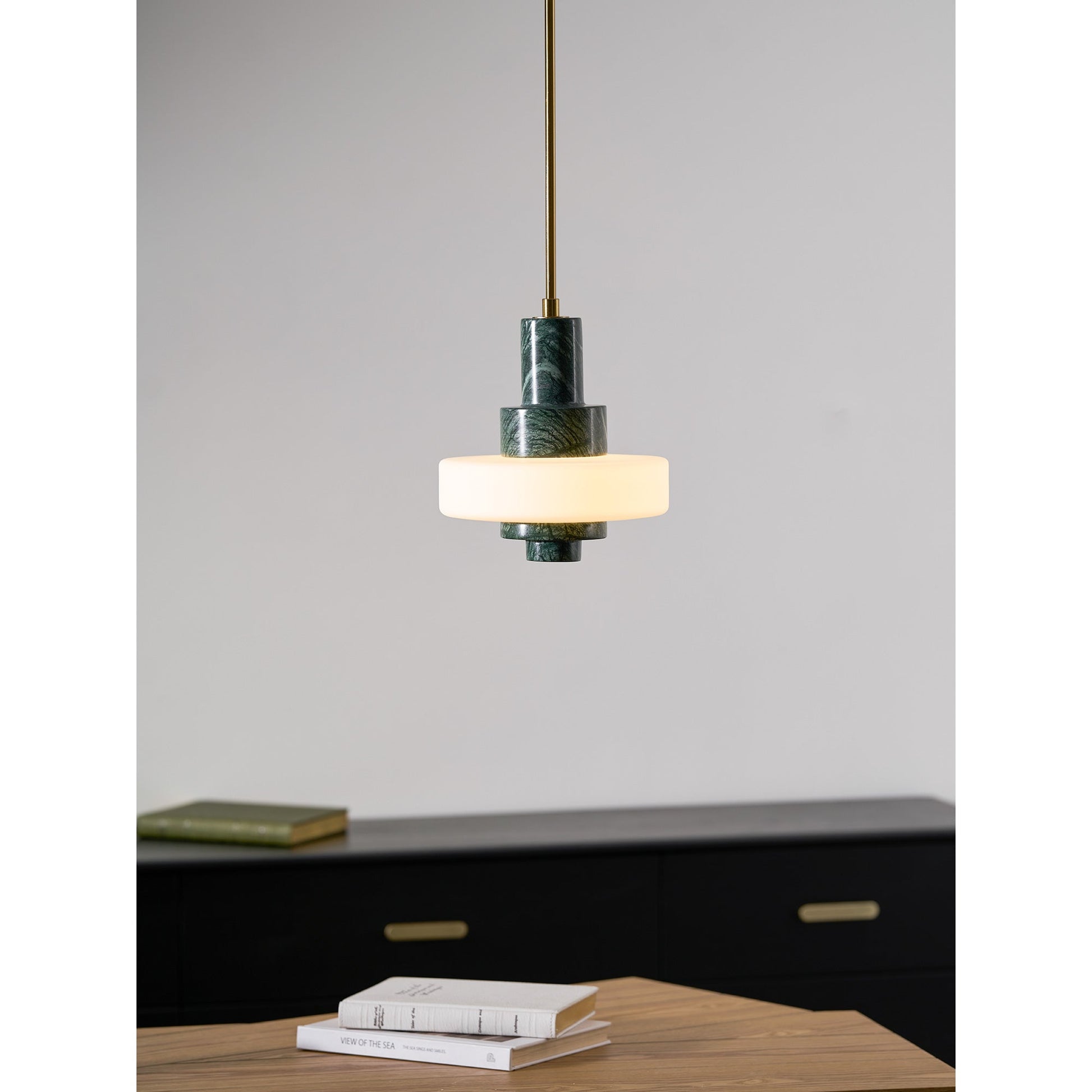 The lamp shown from a distance in a large, well-lit room.