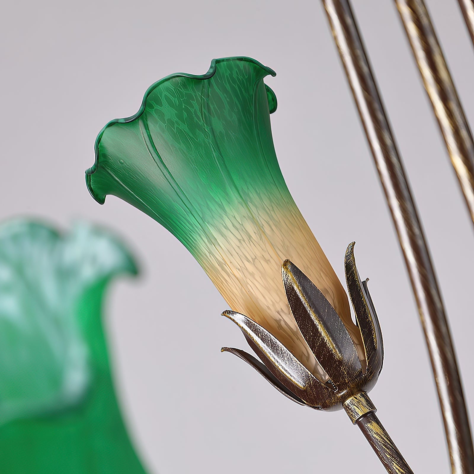 Close-up on the texture of the green glass shade.