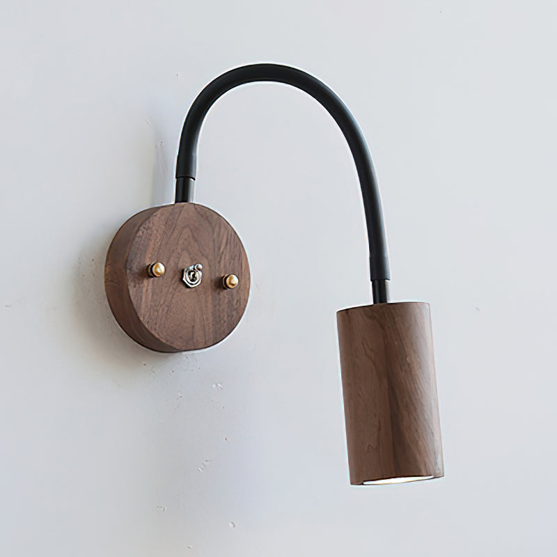 Close-up on the rich wood grain texture of the lamp's backplate.
