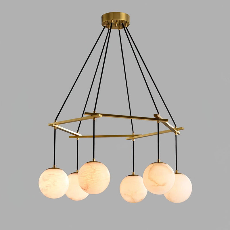 The Miira Chandelier illuminating a dining area with a warm glow
