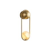 Mila Alabaster Wall Sconce with brass frame against a neutral wall.