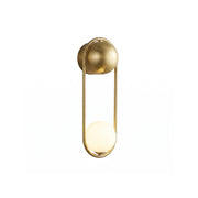 Mila Wall Lamp in polished brass finish with an opal glass globe.