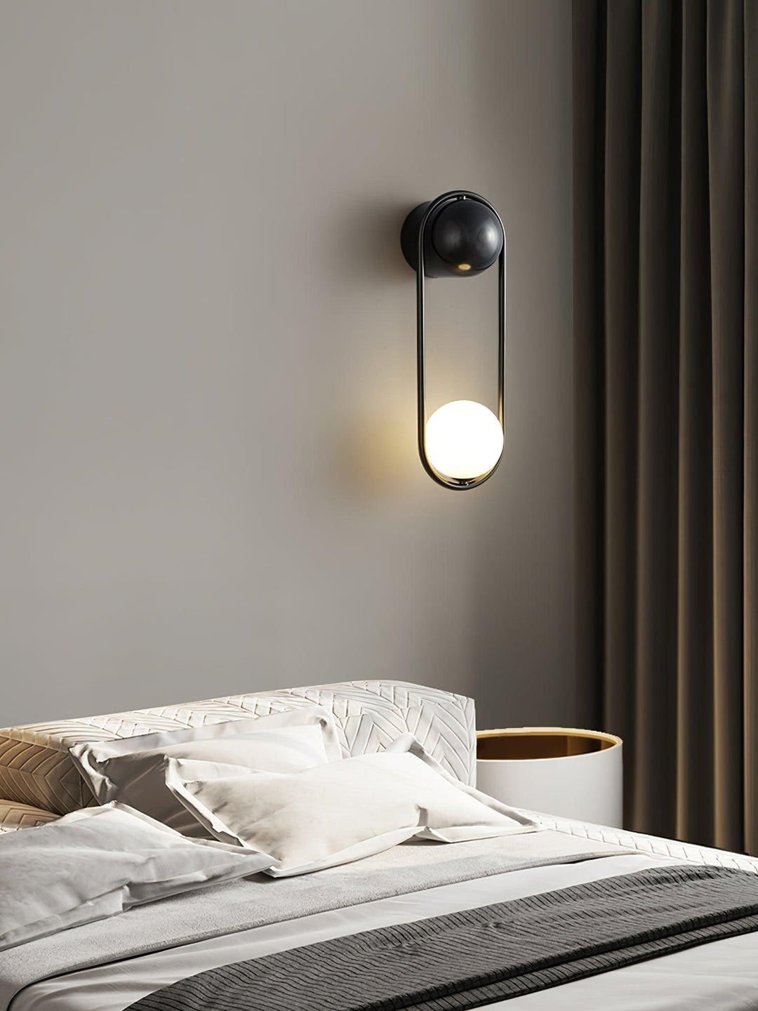 Comparison of the brass, black, and white finishes of the Mila Wall Lamp.
