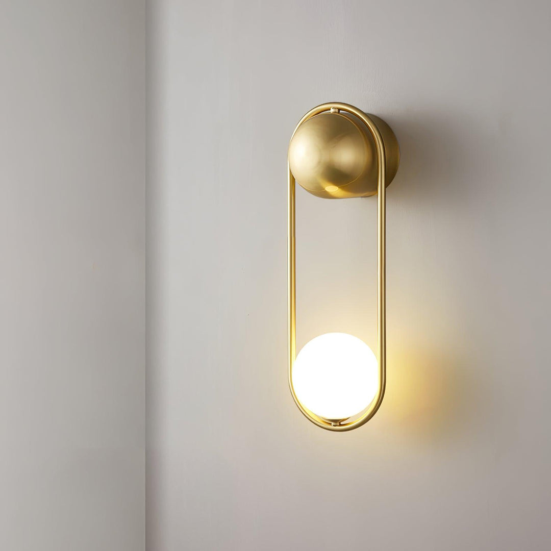 The black Mila Wall Lamp in a contemporary living room.