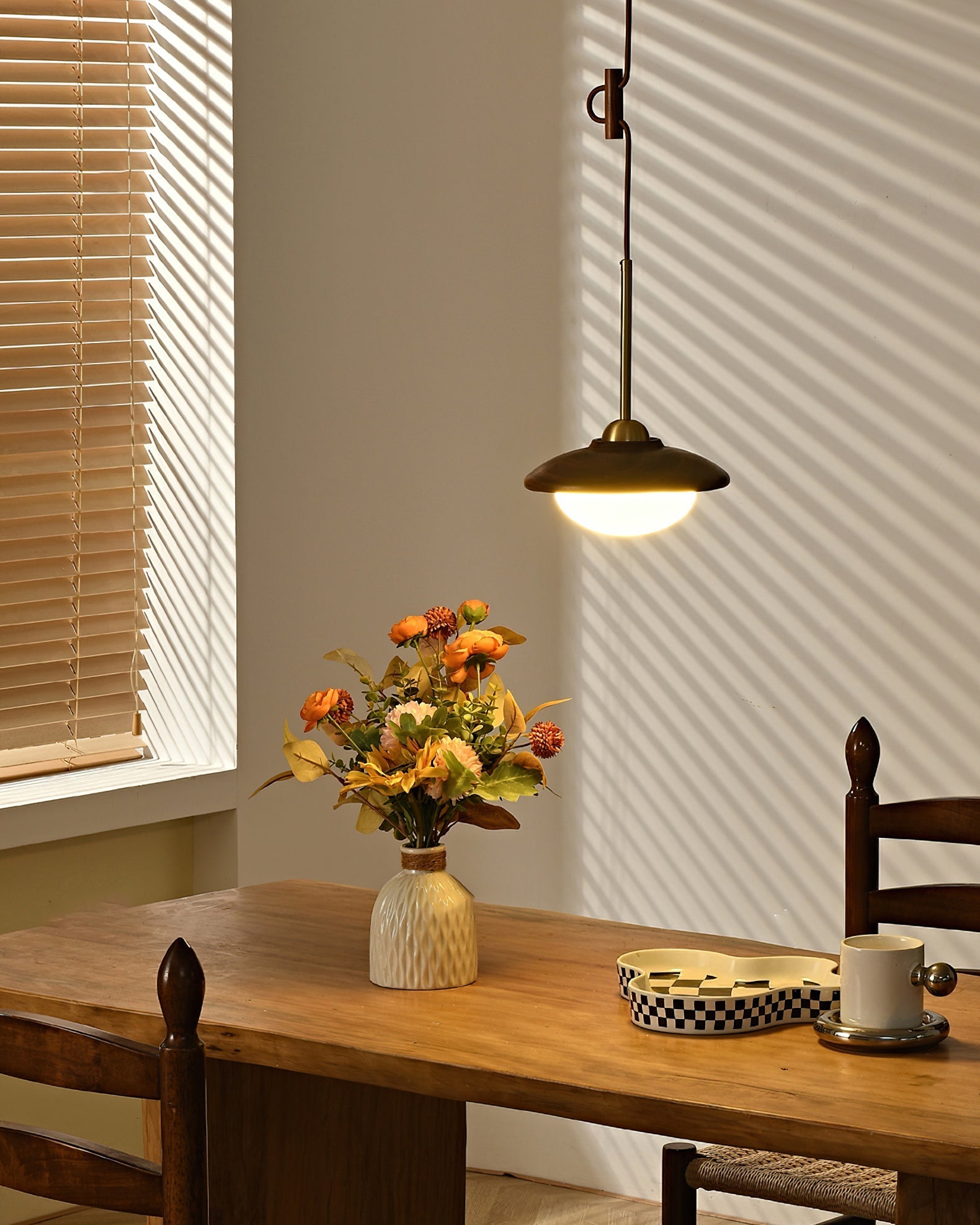 The single-globe pendant light shown against a dark background.