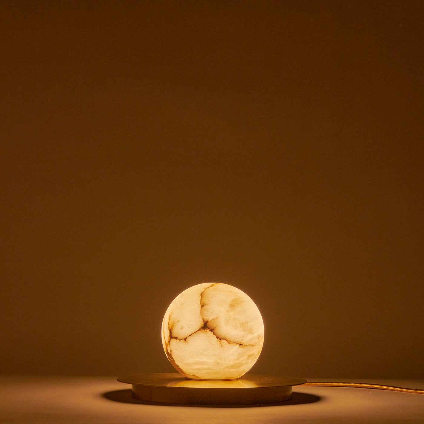 Mini Alabaster Moon Table Lamp styled on a modern bedside table.