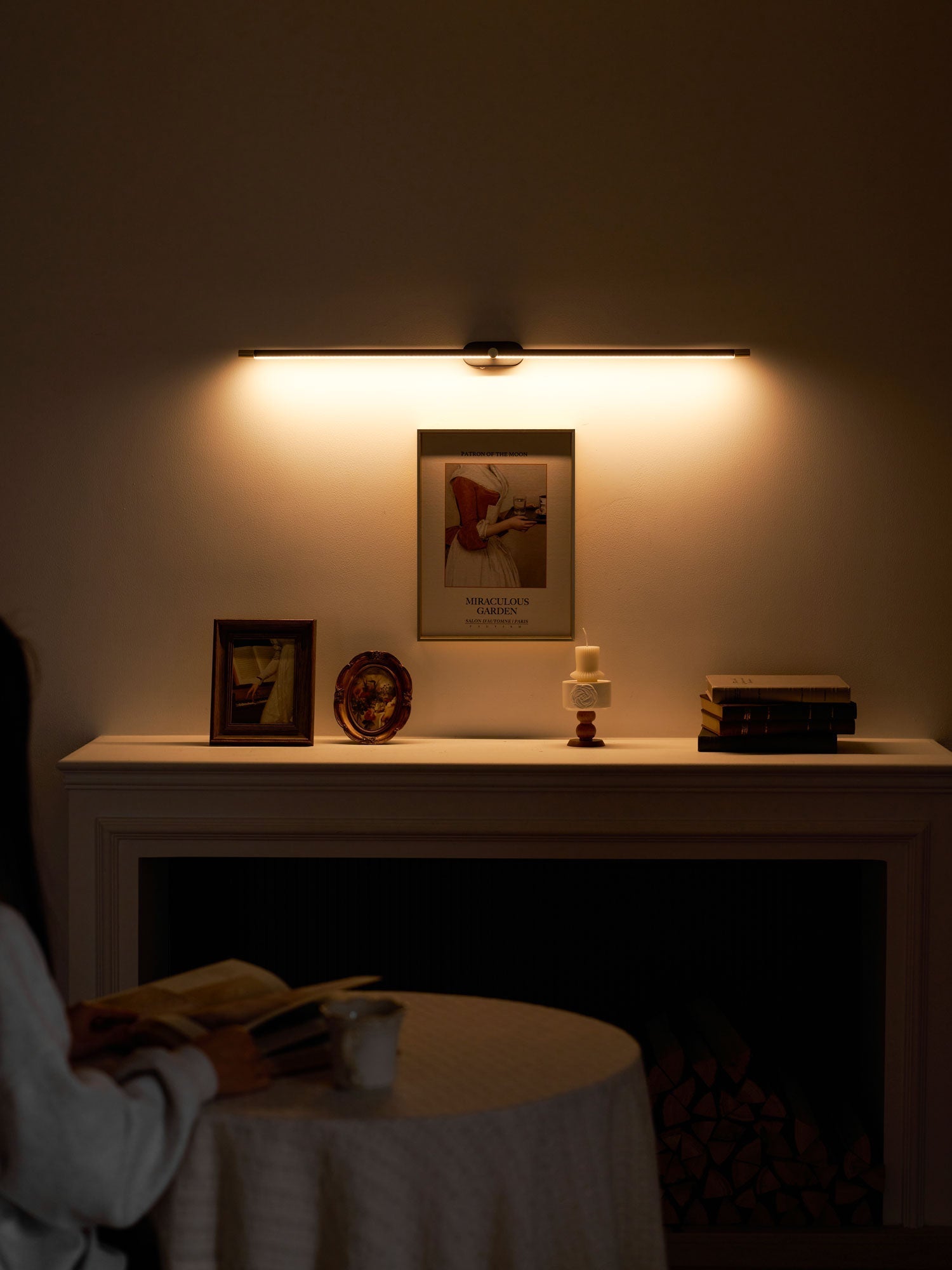 Wall lamp providing accent lighting in a dining area.