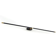 Minimalist linear rechargeable wall lamp in black finish.