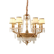 Minka Aston Chandelier with polished brass frame and crystal details.