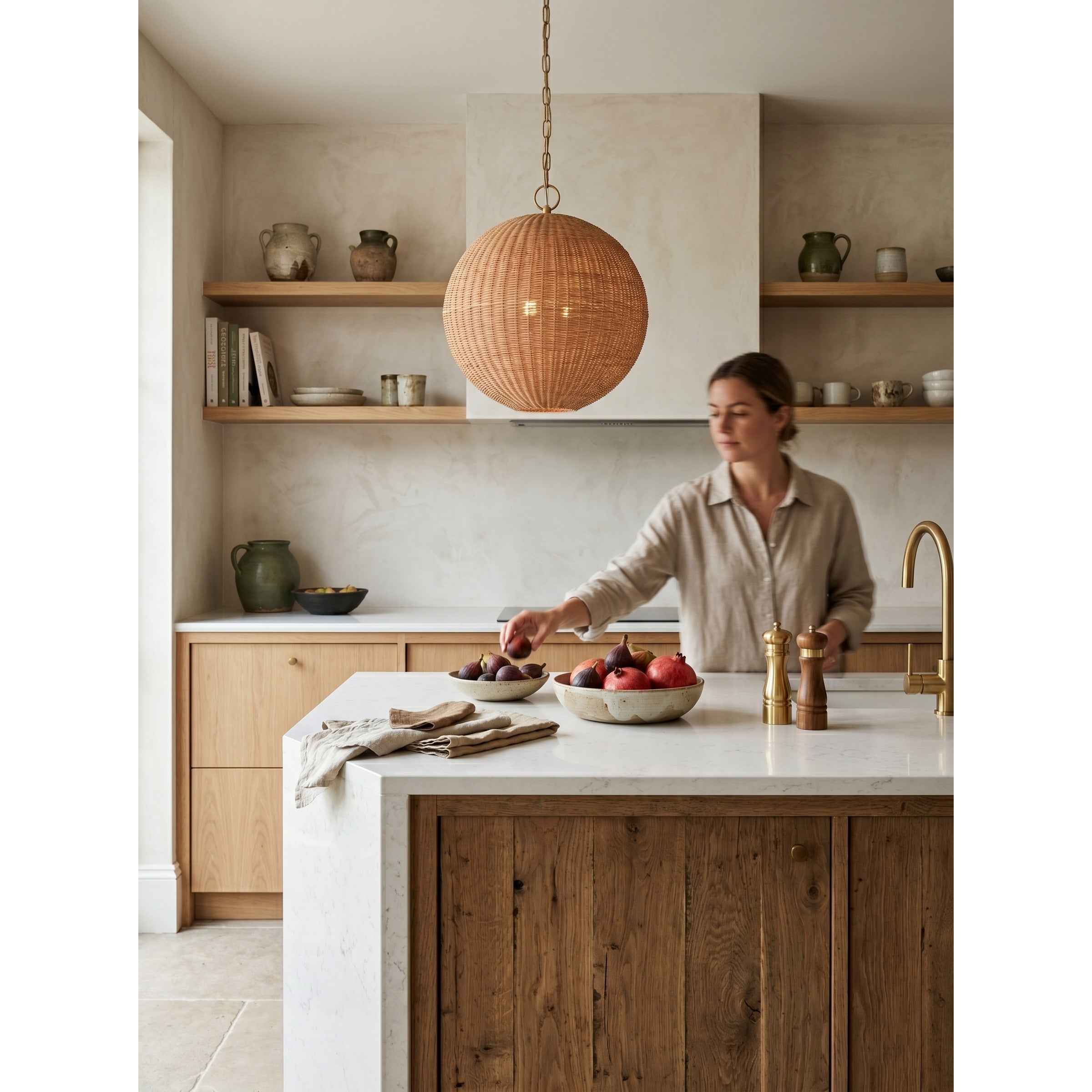 The rattan pendant lamp against a white wall to show scale.