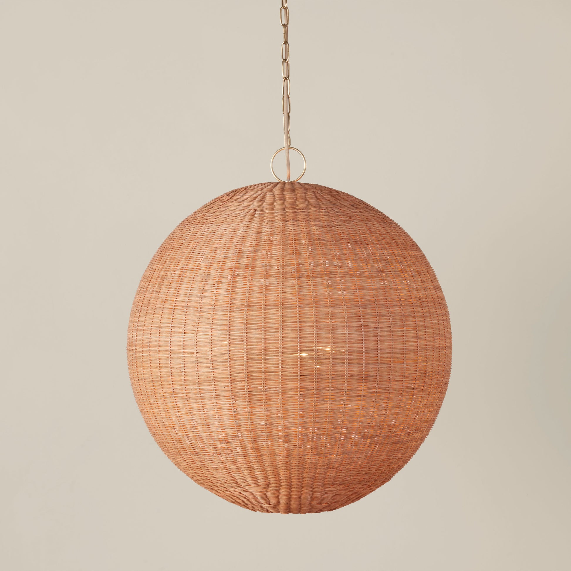 Full view of the round pendant lamp with its complete hanging assembly.