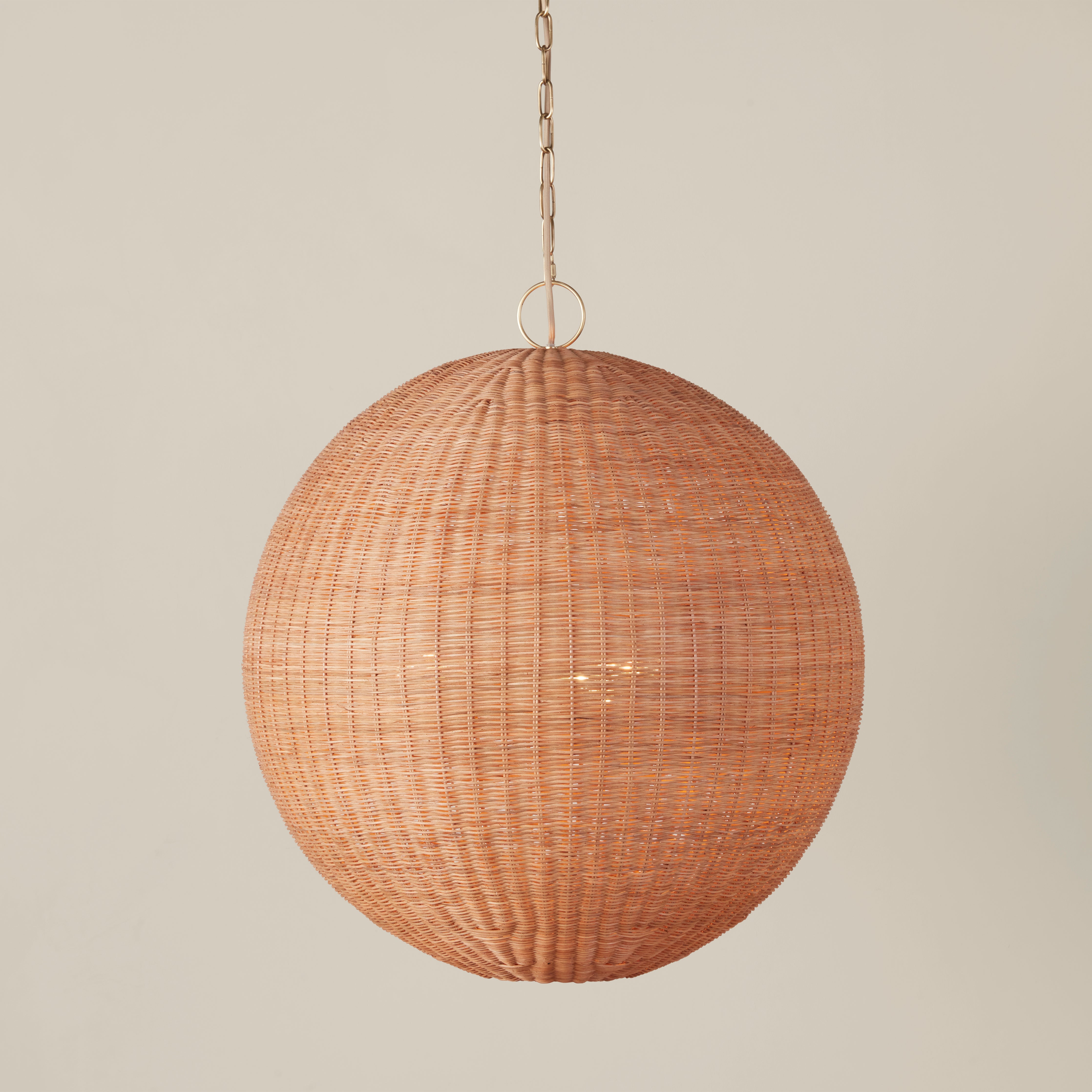 Full view of the round pendant lamp with its complete hanging assembly.