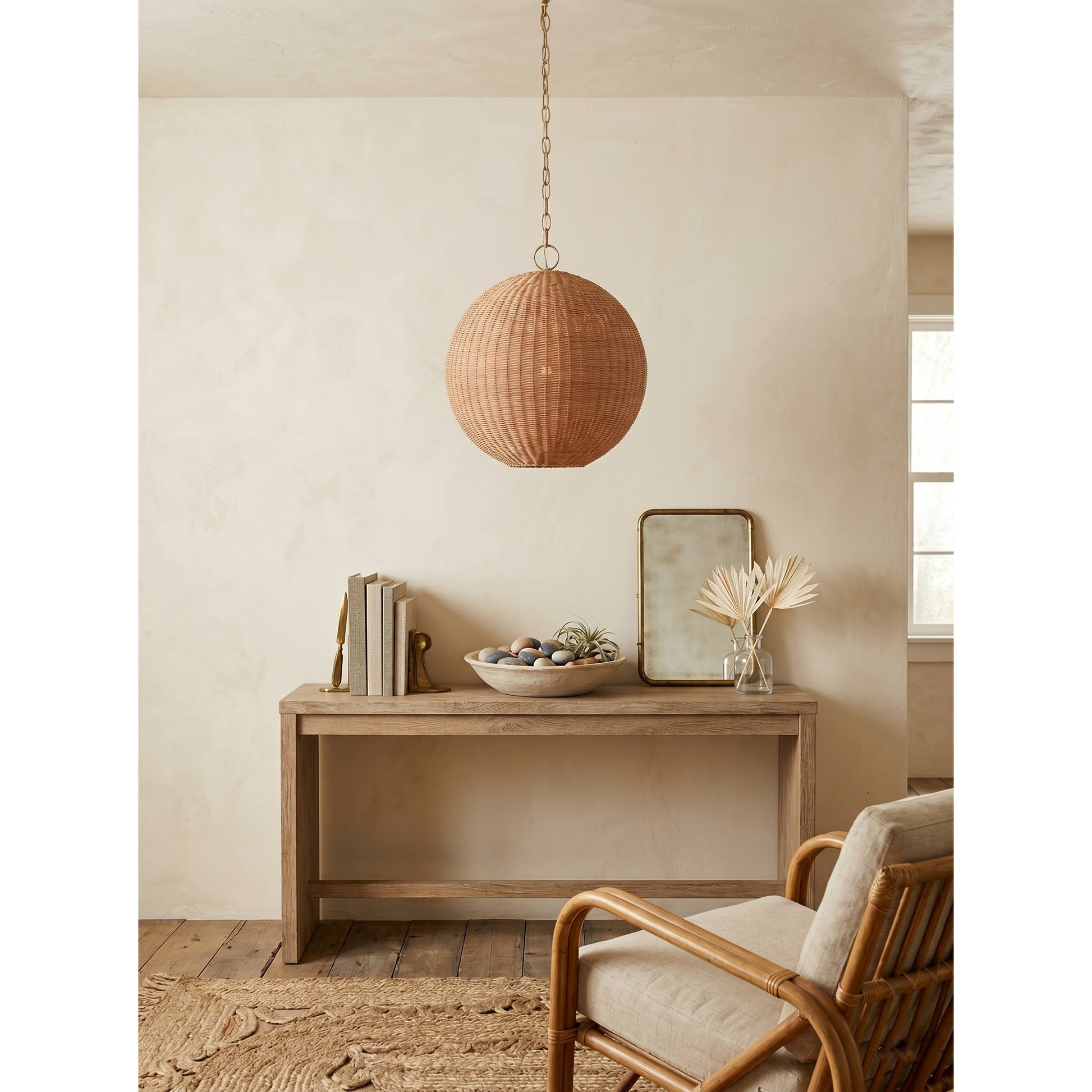 The pendant lamp shown in a bedroom with natural, organic decor.