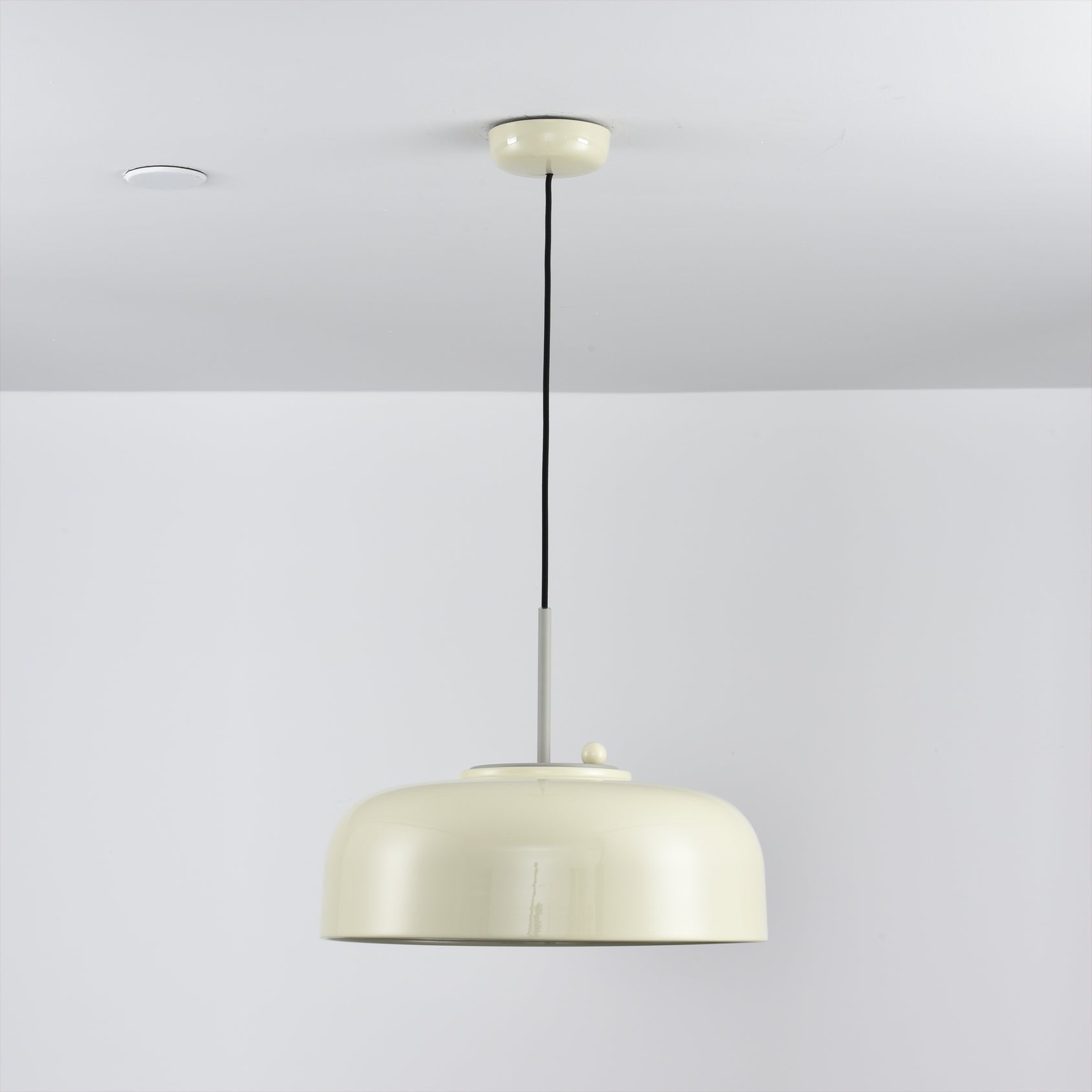 Misha Pendant Light in mustard yellow, in a Scandinavian-style interior.