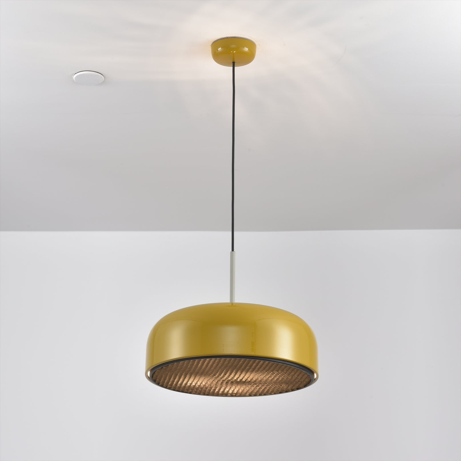 Misha Pendant Light in white, with an Edison bulb installed.