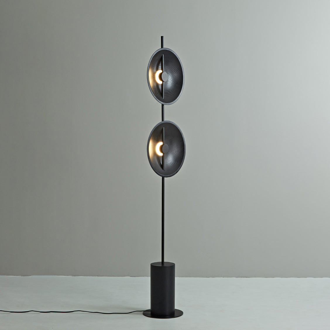 The Mito Floor Lamp from a low angle, emphasizing its height.