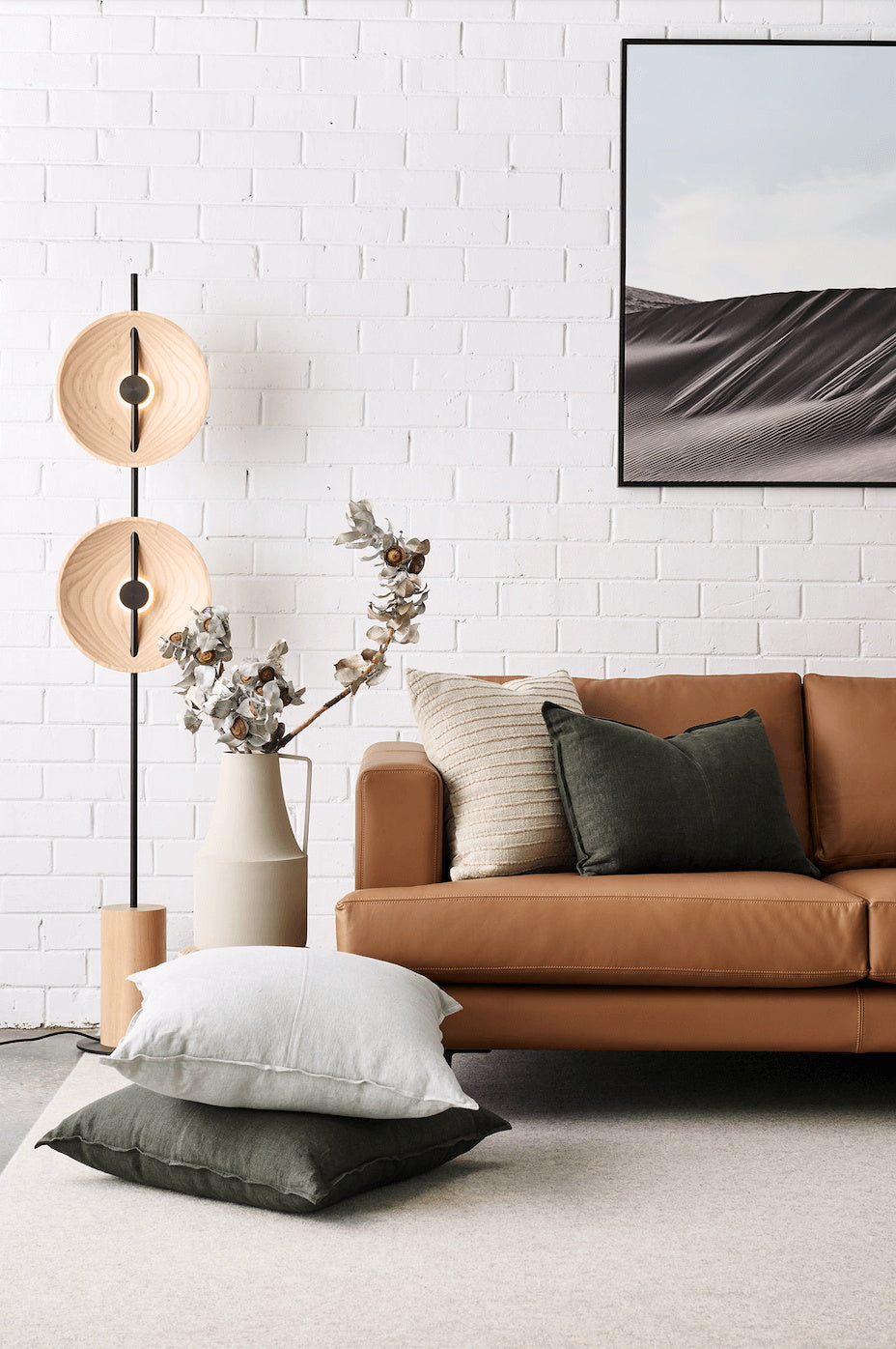 Close-up of the dual wooden lampshades on the Mito Floor Lamp.