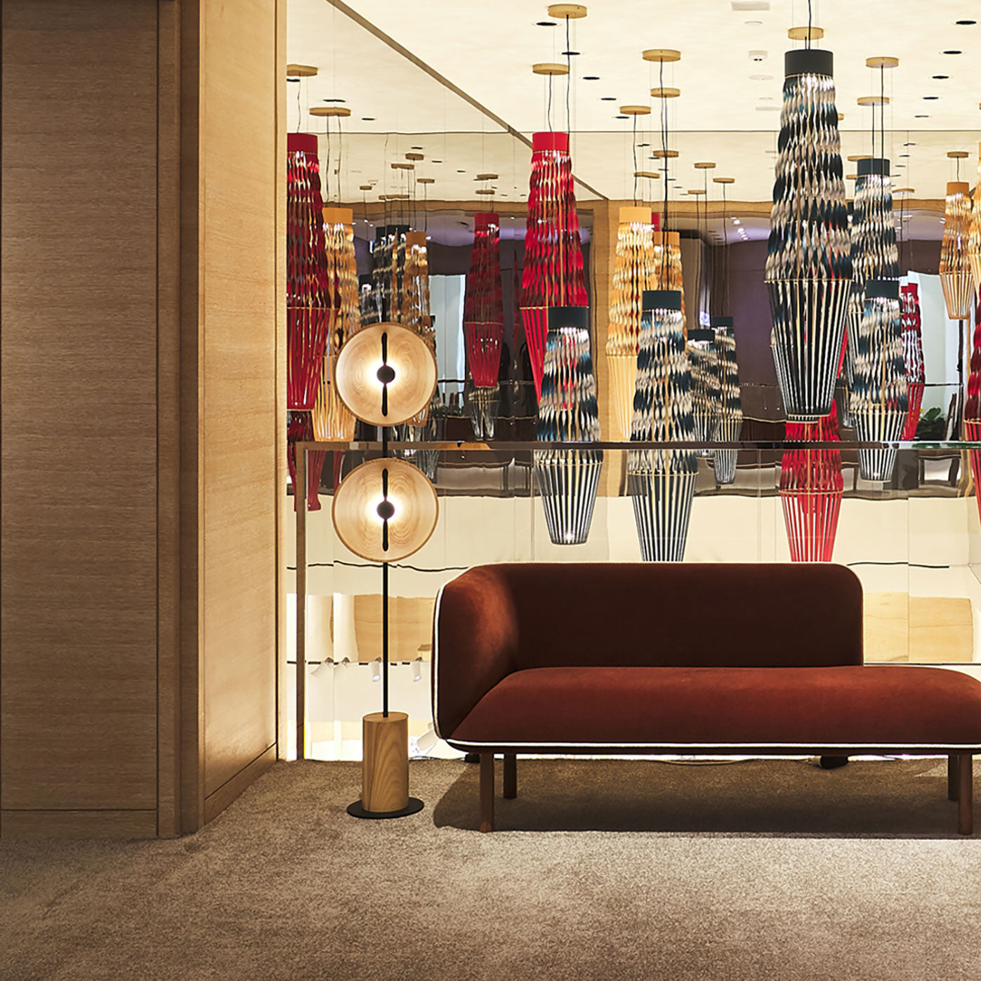 The Mito Floor Lamp illuminating a cozy reading corner.
