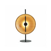 Mito Table Lamp with a minimalist wood shade and black iron body.