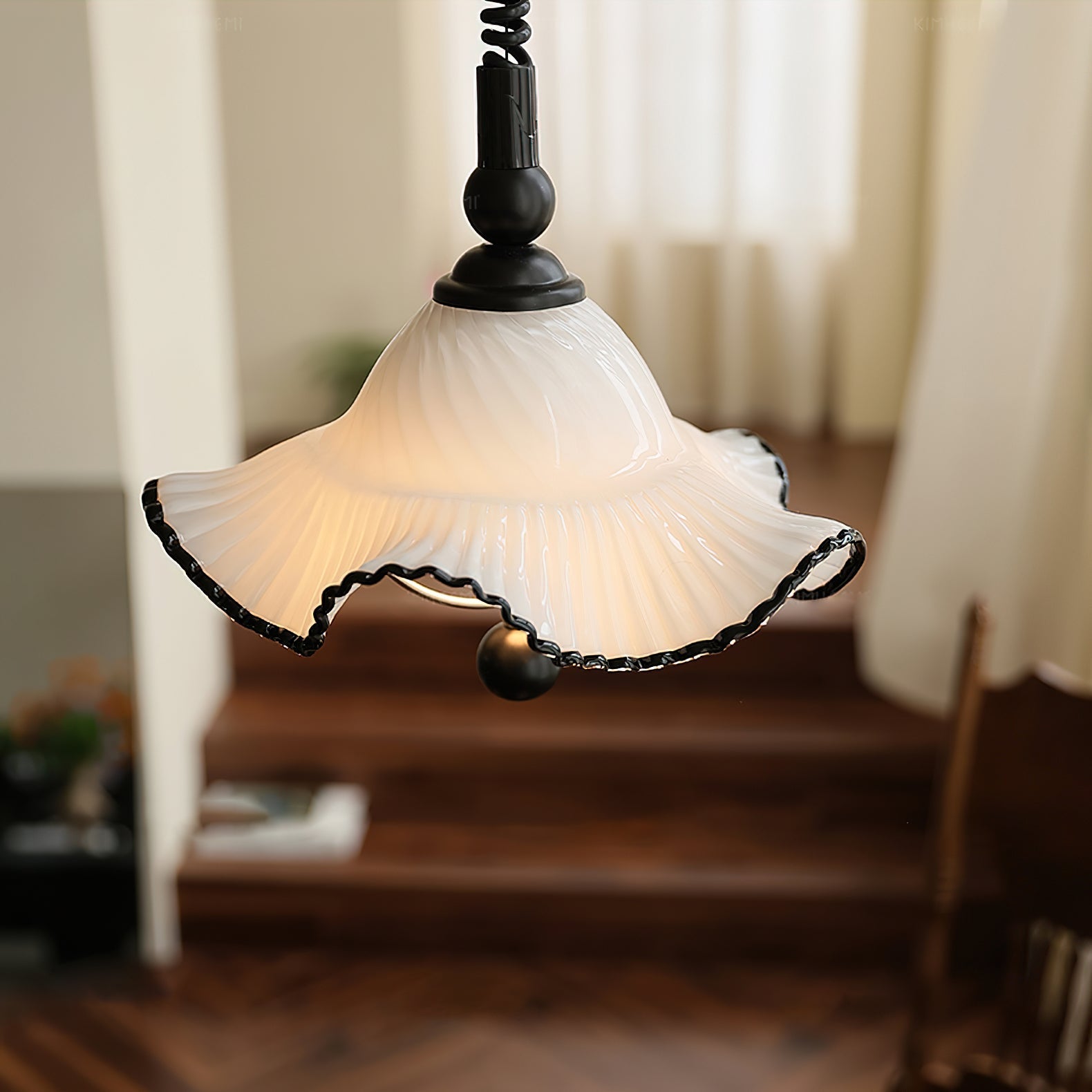 The contrast of the white glass and black trim on the Mobo Pendant Light.
