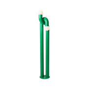 Modulation Floor Lamp in green, showcasing its linear iron body and two glass globes.