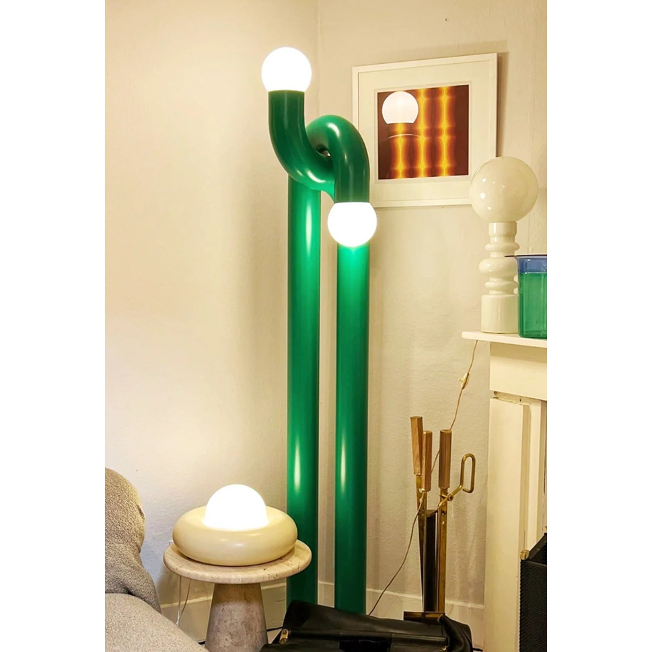 Side profile of the green Modulation Floor Lamp, showing its height and form.