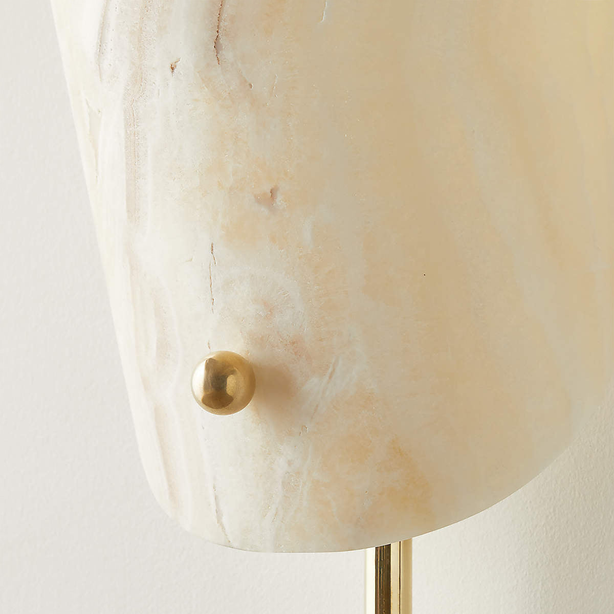 Close-up view of the Monet Sconce, highlighting the natural veining of the onyx shade.