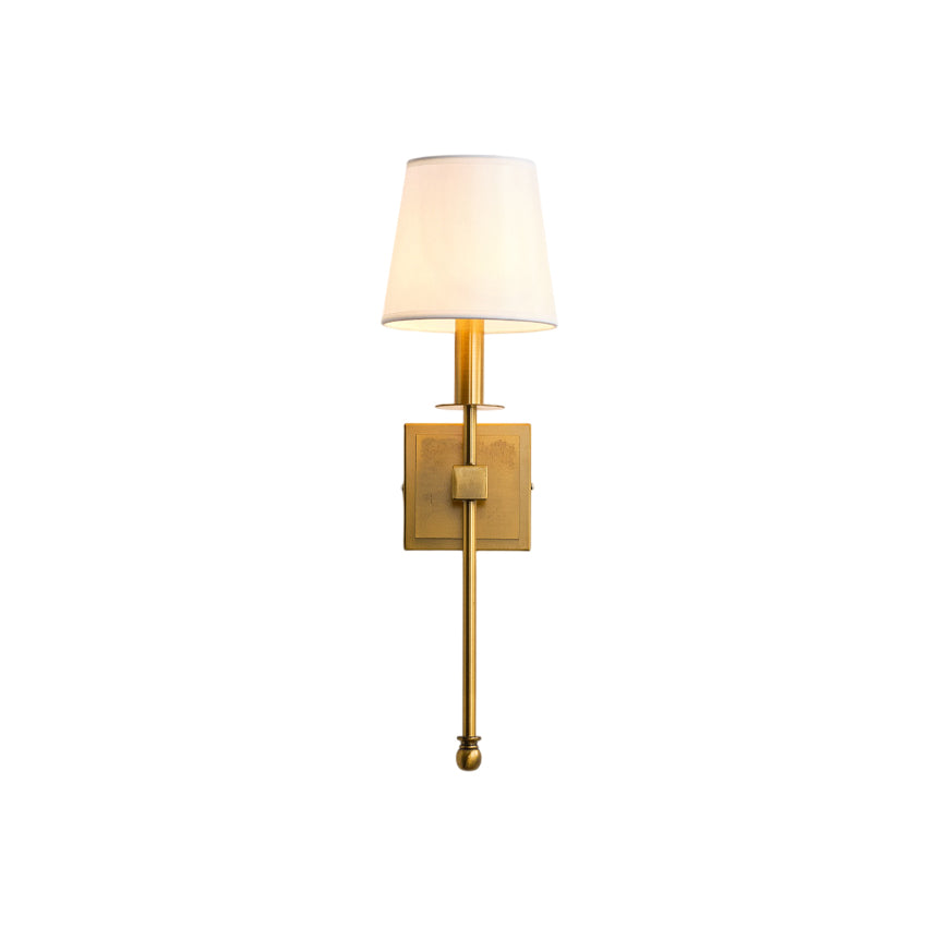 Monroe Wall Lamp with a gold iron body and white fabric shade.