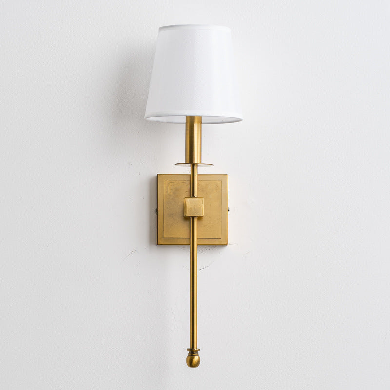 The Monroe Wall Lamp shown lit, casting a warm and inviting glow.