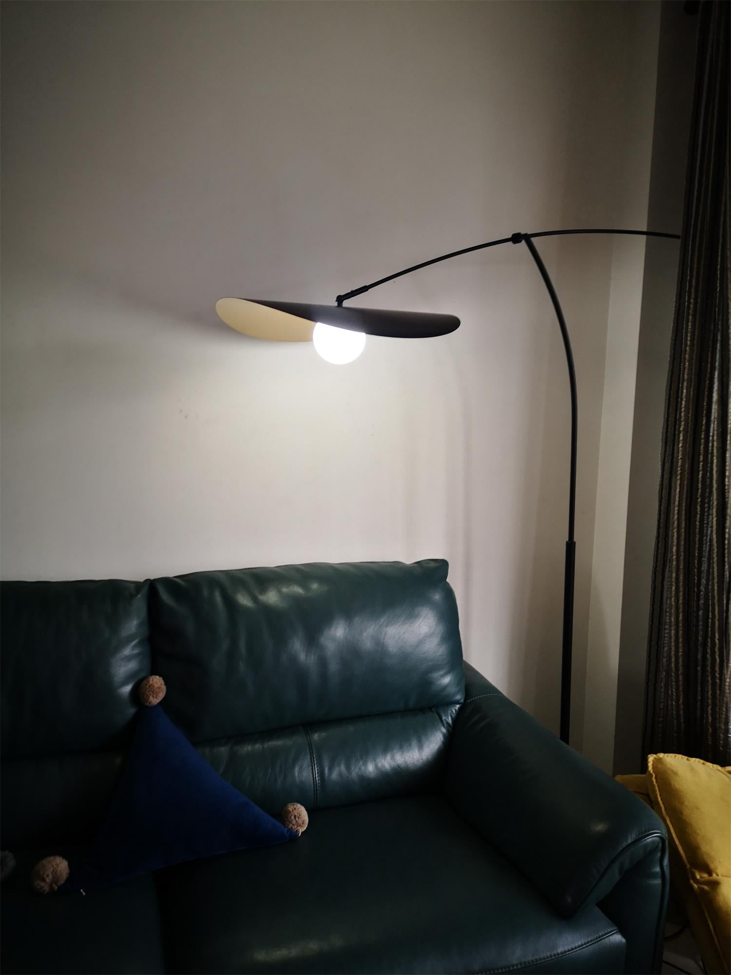 Angled view of the Myrna Plug-In Wall Lamp.