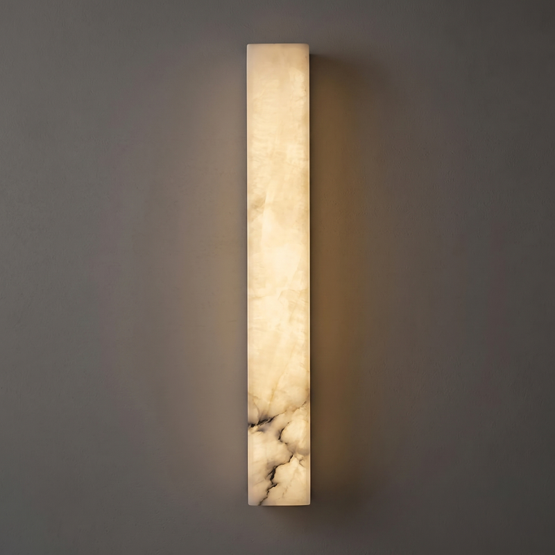 Cylindrical alabaster sconce with a black frame.