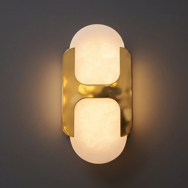 Long-arm alabaster sconce with a bronze arm.
