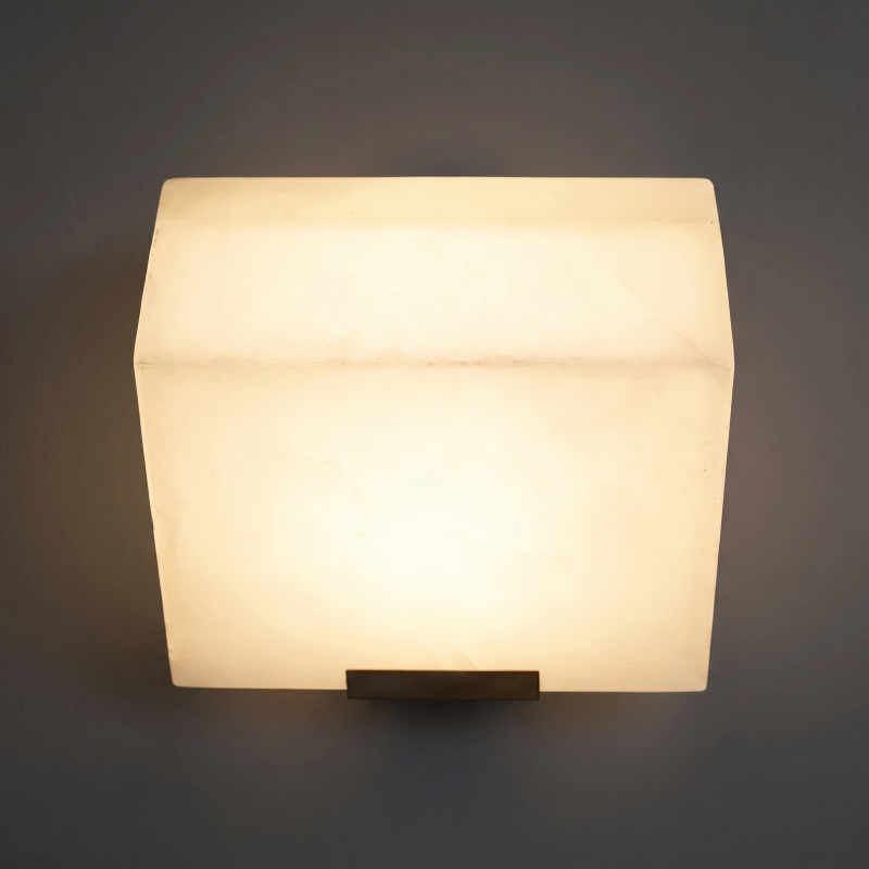 Sculptural stacked alabaster wall light in a modern interior.