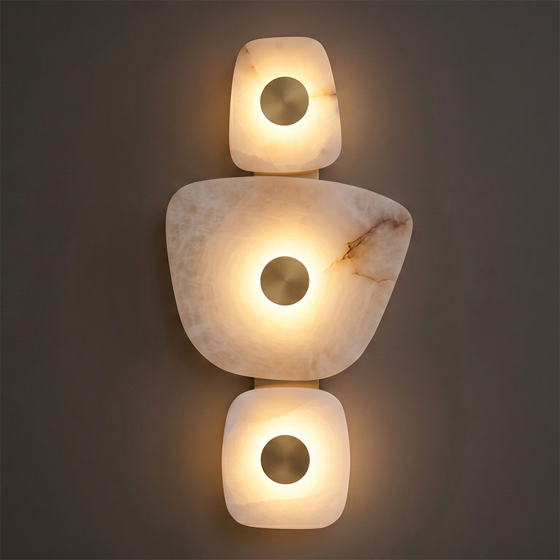 A row of square alabaster sconces on a dark wall.