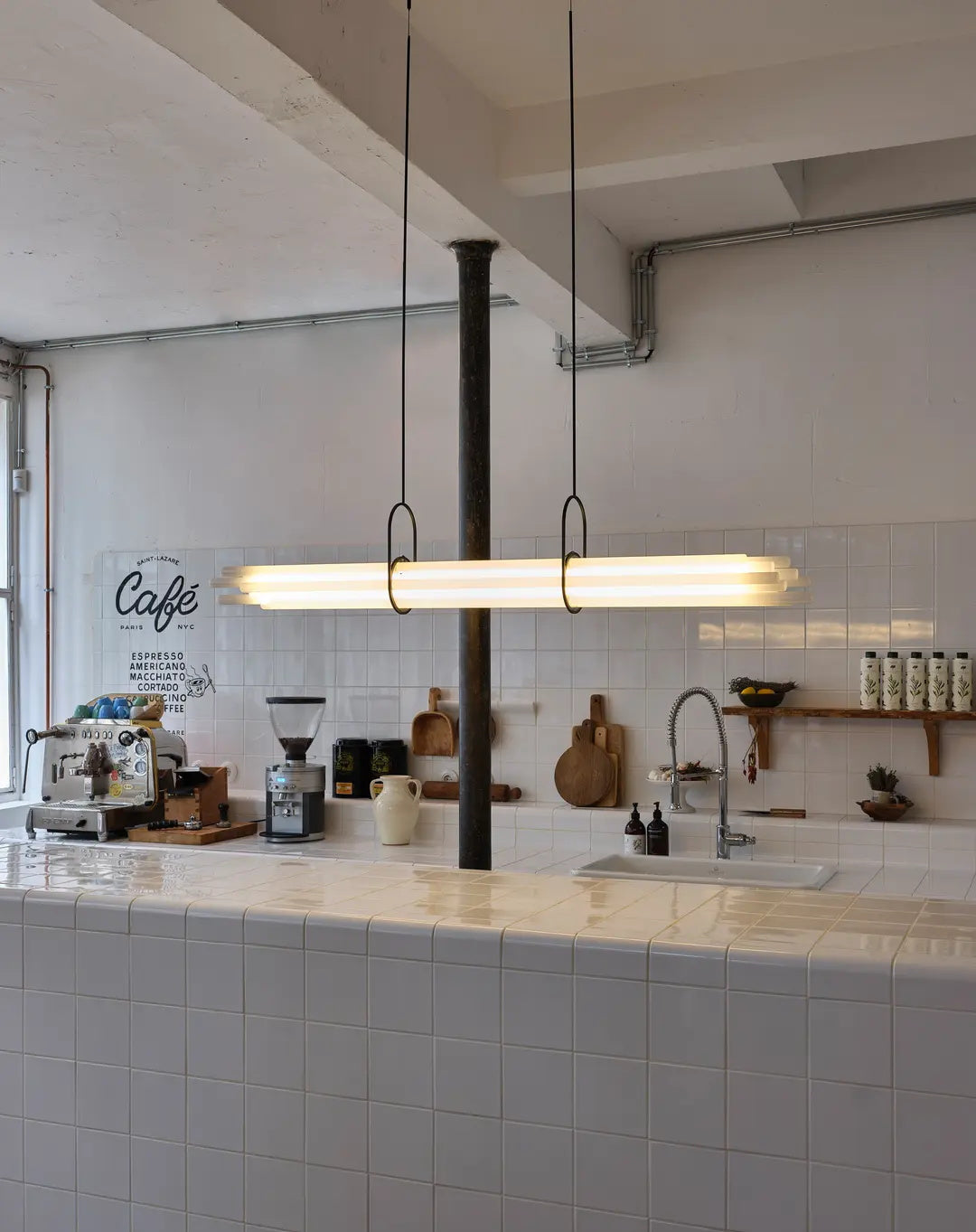 The NL 12 chandelier shown above a modern dining table.