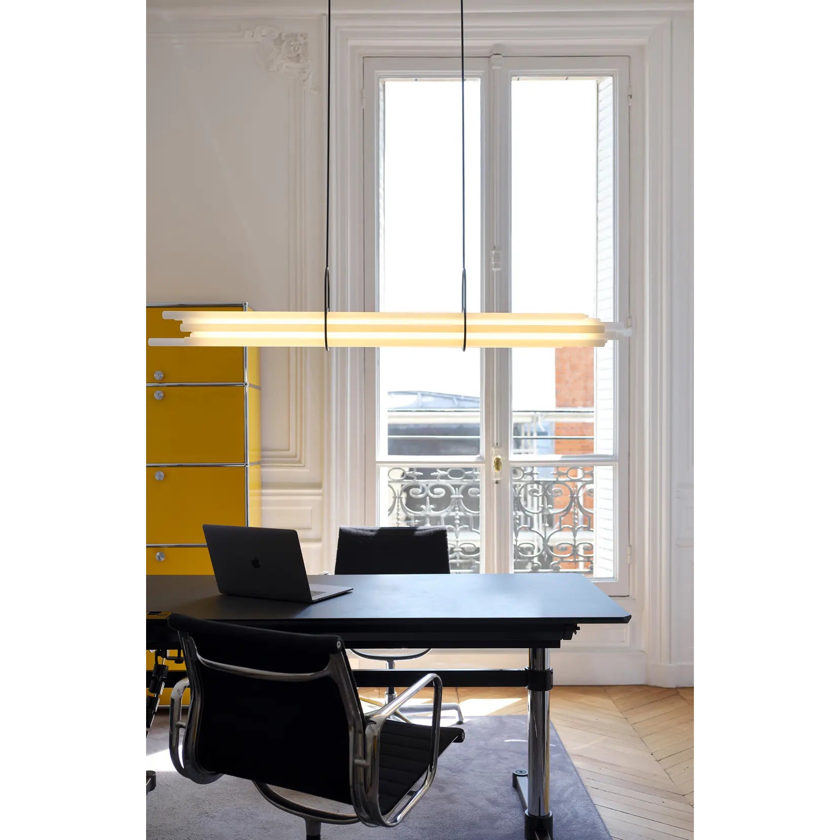 Angled view showcasing the sculptural form of the NL 12 chandelier.