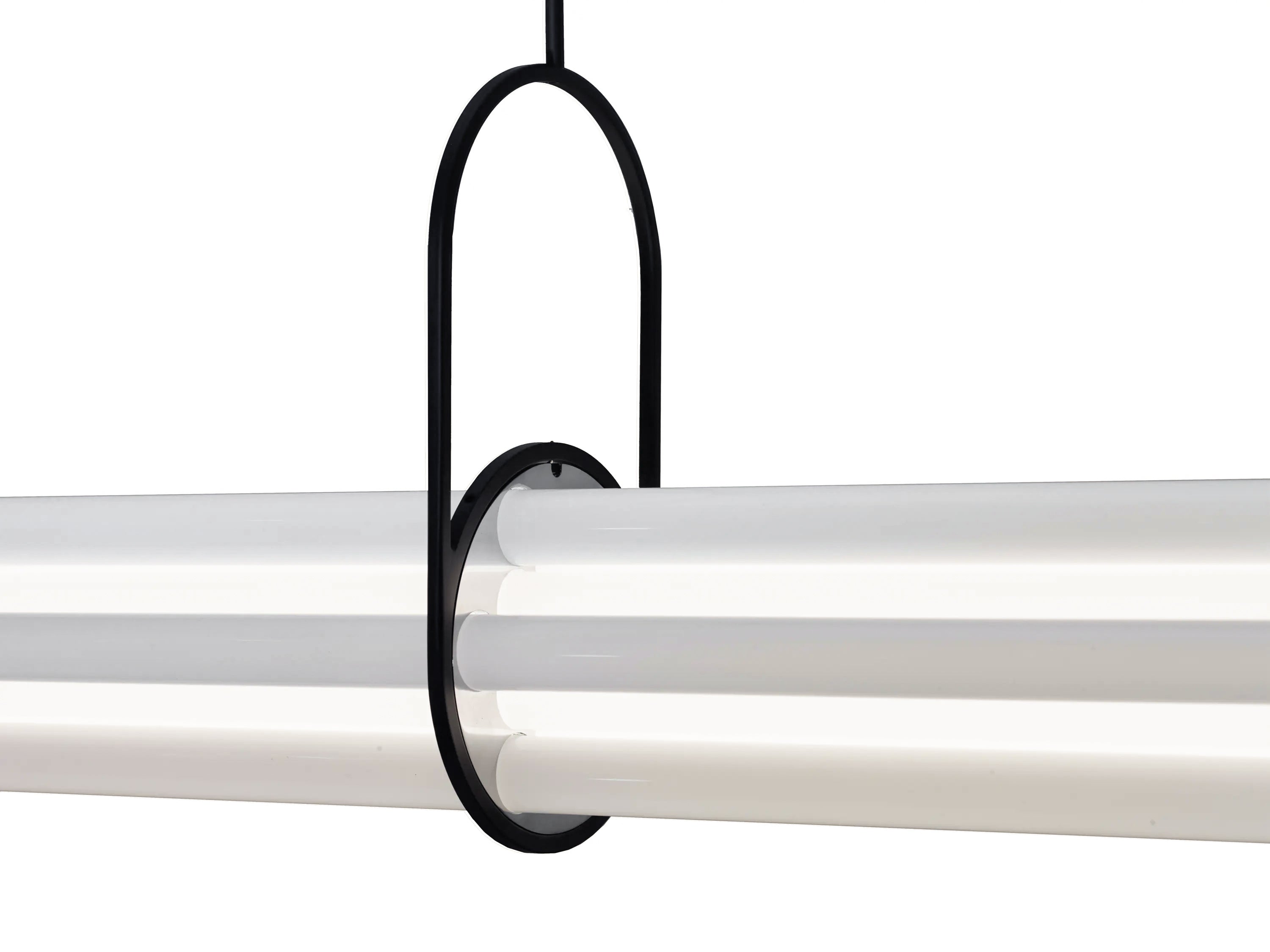 Lifestyle image of the NL 12 chandelier in a contemporary dining room.