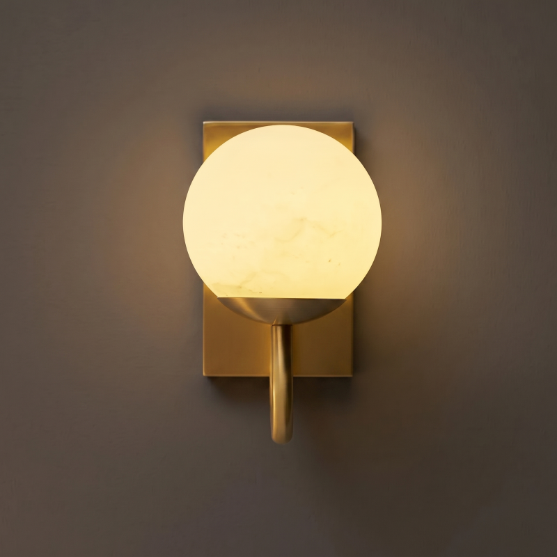 Application shot of an alabaster sconce in a restaurant booth.