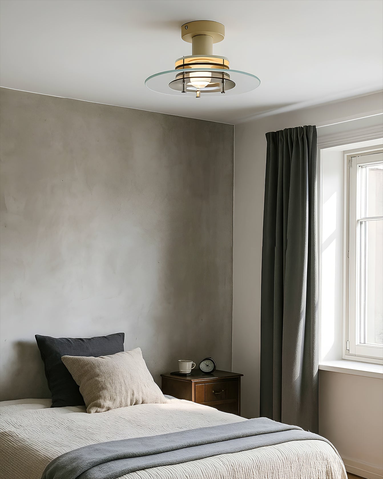 Detail shot showcasing the white metal housing and clear glass shade.